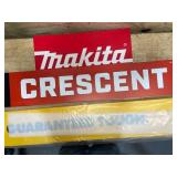 Makita, Crescent, and  Guaranteed Tough  DeWalt signs