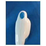 Dritz Jumbo Lint Shaver in blue and white and Brookline Portable Garment Steamer in white.