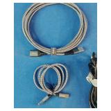 Ten assorted electronic data and charging cables organized against a solid blue background.