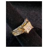 Yellow gold colored multi-row cluster ring featuring a distinctive square or grid-patterned center head. Size 7.25