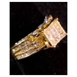 Yellow gold colored multi-row cluster ring featuring a distinctive square or grid-patterned center head. Size 7.25
