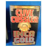 Inca Gold by Clive Cussler and Live Wire by Harlan Coben, both popular suspense thrillers.