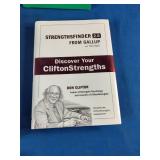 Collection of six self-improvement, financial literacy, leadership, and communication books laid out on a blue fabric surface.