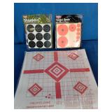 A collection of shooting range accessories designed for firearm target practice and optic zeroing.