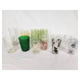 Vintage Decorative Glassware Including Flintstones and Animal Designs, Green Patterned Glasses, and Clear Glass Sets