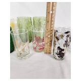 Vintage Decorative Glassware Including Flintstones and Animal Designs, Green Patterned Glasses, and Clear Glass Sets