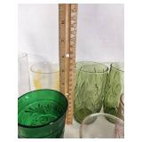 Vintage Decorative Glassware Including Flintstones and Animal Designs, Green Patterned Glasses, and Clear Glass Sets