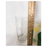 Vintage Decorative Glassware Including Flintstones and Animal Designs, Green Patterned Glasses, and Clear Glass Sets