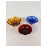 Amber, blue, and red decorative glass bowls