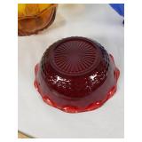 Amber, blue, and red decorative glass bowls