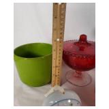 Assorted Glass and Ceramic Home Decor Items including Red Glass Compote, Blue Rooster Figurine, and Heart-Shaped Plate with Religious Image