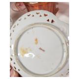 Assorted Glass and Ceramic Home Decor Items including Red Glass Compote, Blue Rooster Figurine, and Heart-Shaped Plate with Religious Image
