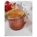 Assorted Glass and Ceramic Home Decor Items including Red Glass Compote, Blue Rooster Figurine, and Heart-Shaped Plate with Religious Image