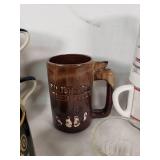 Mug Lot including Mountainside Stoneware and San Antonio River Walk Mug, A&W Root Beer Glass, and Whole Hog Efficiency Mugs
