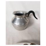 Vintage kitchenware including Glasbake and Tupperware dishes, ABCO aluminum pitcher, Vollrath stainless steel pitcher, and a metal grater with mold pan