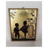 Bird Island Farmers Elevator Co. Wall Thermometer features a silhouette design of children and foliage