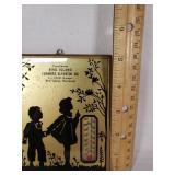 Bird Island Farmers Elevator Co. Wall Thermometer features a silhouette design of children and foliage