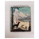 Lake Lillian Farmers Elevator Co. Vintage Thermometer Plaque features a scenic winter landscape with a silhouette of a deer and a person with sled dogs
