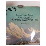 Lake Lillian Farmers Elevator Co. Vintage Thermometer Plaque features a scenic winter landscape with a silhouette of a deer and a person with sled dogs