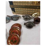 Vintage Tin Toy Tea Set with Decorative Plates and Cups, Stored in a Patterned Trunk