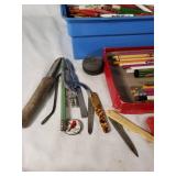 Assorted vintage items including 45 RPM vinyl records, pencils, and tools