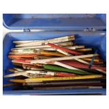 Assorted vintage items including 45 RPM vinyl records, pencils, and tools