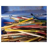 Assorted vintage items including 45 RPM vinyl records, pencils, and tools