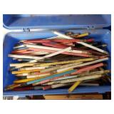 Assorted vintage items including 45 RPM vinyl records, pencils, and tools