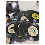 Assorted vintage items including 45 RPM vinyl records, pencils, and tools