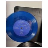 Assorted vintage items including 45 RPM vinyl records, pencils, and tools