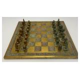 Est. $400.00- $600.00 14" x 14" Vintage Greek Brutalist Bronze Chess Set With Matching Brass Board