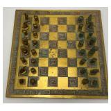 Est. $400.00- $600.00 14" x 14" Vintage Greek Brutalist Bronze Chess Set With Matching Brass Board