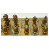 Est. $400.00- $600.00 14" x 14" Vintage Greek Brutalist Bronze Chess Set With Matching Brass Board