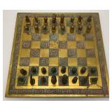Est. $400.00- $600.00 14" x 14" Vintage Greek Brutalist Bronze Chess Set With Matching Brass Board