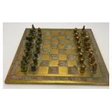 Est. $400.00- $600.00 14" x 14" Vintage Greek Brutalist Bronze Chess Set With Matching Brass Board