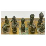 Est. $400.00- $600.00 14" x 14" Vintage Greek Brutalist Bronze Chess Set With Matching Brass Board