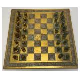 Est. $400.00- $600.00 14" x 14" Vintage Greek Brutalist Bronze Chess Set With Matching Brass Board