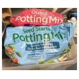 Bucket of potting mix, seed starters and miscellaneous