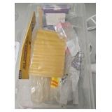 plastic container of glue and glue gun
