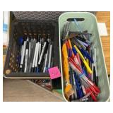 two bins of pens