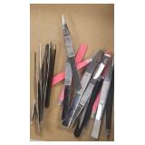 tote of tweezers and crucible tongs