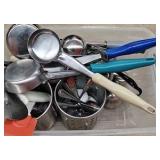 bucket of kitchen utensils