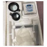 Earth science transparencies, books, fluoride, transfer bottles, bags of prisms