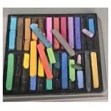 assorted pastels and charcoal