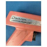 Sunpro Actron CP7504 inductive timing light, used for precise engine timing adjustments.