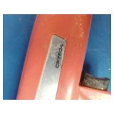Sunpro Actron CP7504 inductive timing light, used for precise engine timing adjustments.