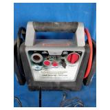 Peak PKC0AS Portable Power System 300, featuring a grey and black housing with a top handle.