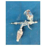 K-3 mini air spray paint gun used for detailed finishing projects.