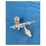 K-3 mini air spray paint gun used for detailed finishing projects.