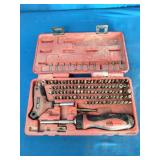 Mac Tools 123-Piece Master Bit Set (model SBDR123SA or similar), featuring a red plastic carrying case.